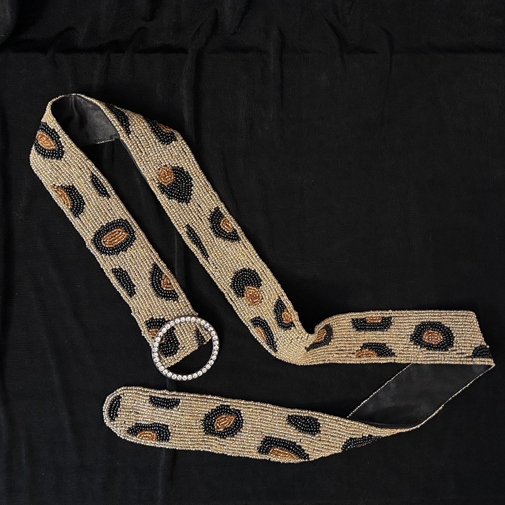 Beaded animal print belt with rhinestone buckle, size s.